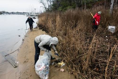 picking up trash along rive